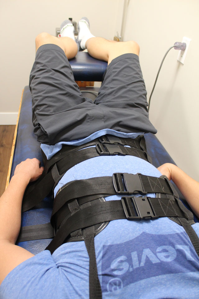 Patient receiving decompression therapy at RehabMAX Physio
